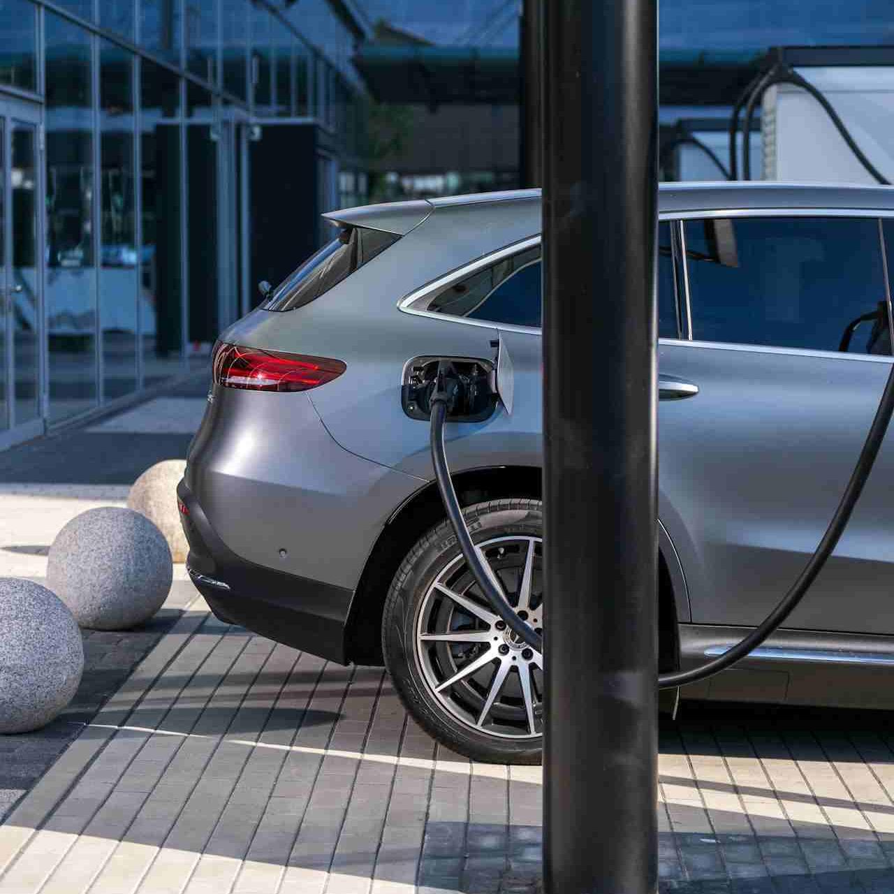 High demand charges from simultaneous EV charging creating power spikes