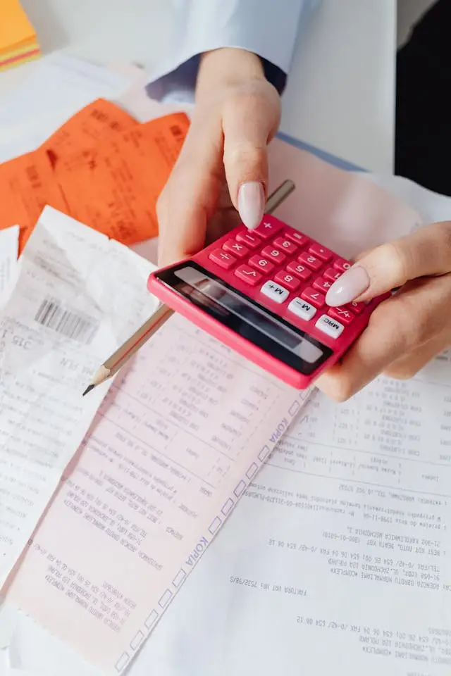 Homeowner looking at high electricity bill statement – rising energy costs for household